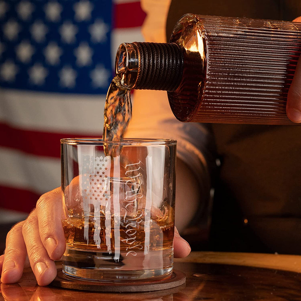 Pouring of whiskey to We The People Patriotic American Flag - Old Fashioned Whiskey Rocks Bourbon Glass